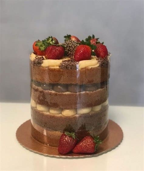 A Chocolate Cake With Strawberries On Top