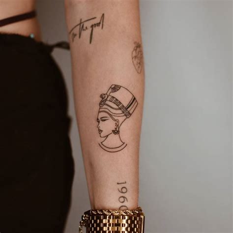 Fine Line Nefertiti Tattoo Located On The Forearm