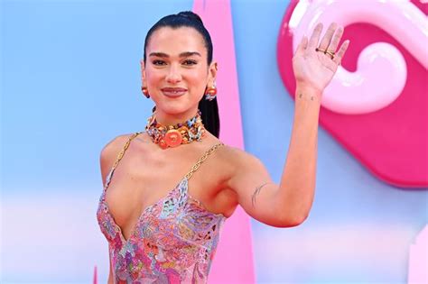 Dua Lipa Dazzles As She Slips Into Figure Hugging Plunging Rhinestone