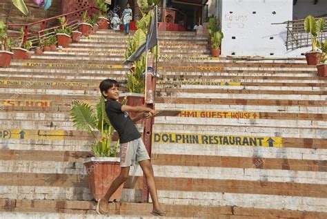 Indian boy plays cricket on ghat in Varanasi, India. – Stock Editorial ...