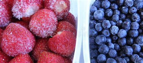 Frozen Strawberries And Blueberries In A Plastic Containers Stock Image