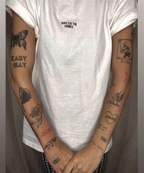 A Man With Many Tattoos On His Arms