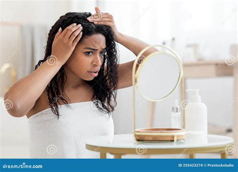 Dandruff Problem Upset African American Female Looking To Mirror At