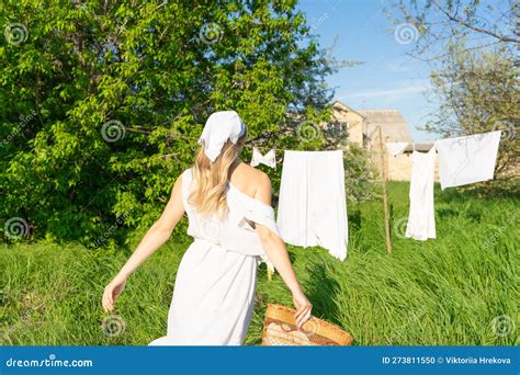 Young Woman Hanging Laundry Outdoors Beautiful Girl Working In