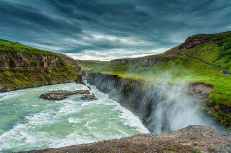 Gullfoss Powerful Waterfall Flowing From Hvita River And Moody Sky In