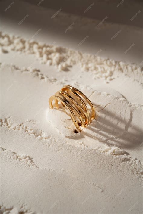 Premium Photo | View of luxurious golden ring with white dust