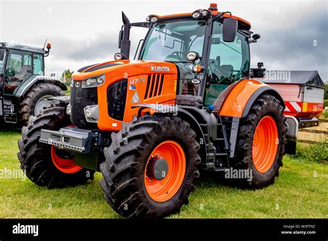 Modern Agricultural Tractors And Farm Machinery At A Country Fair And