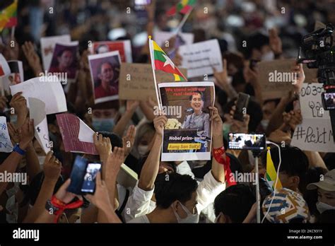 Myanmar Residents In Bangkok Hold Up A Picture Of Leader Aung San Suu