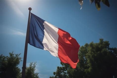 Premium AI Image Flag Of France Waving In The Wind Against Blue Sky