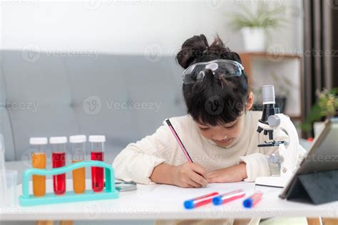 young girl play science experiments for homeschooling 13063710 Stock ...