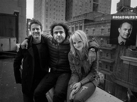 Alejandro G. Inarritu posing on the set of 'Birdman' with his two ...