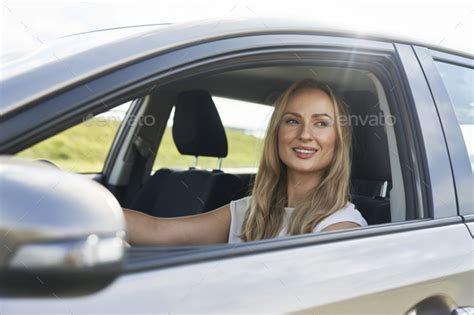 Caucasian Adult Blonde Woman Driving A Car Stock Photo By Gpointstudio