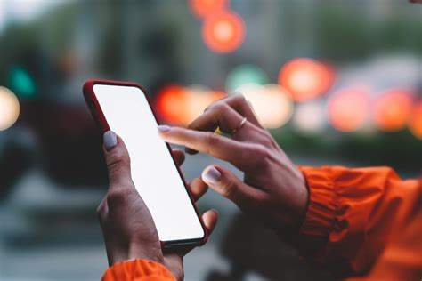 Close Up View Of Female Hands Holding Mobile Phone Touching BHtheChange