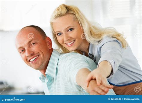 Embraced Couple Enjoying in Their Kitchen Stock Photo - Image of embracing, caucasian: 37669648