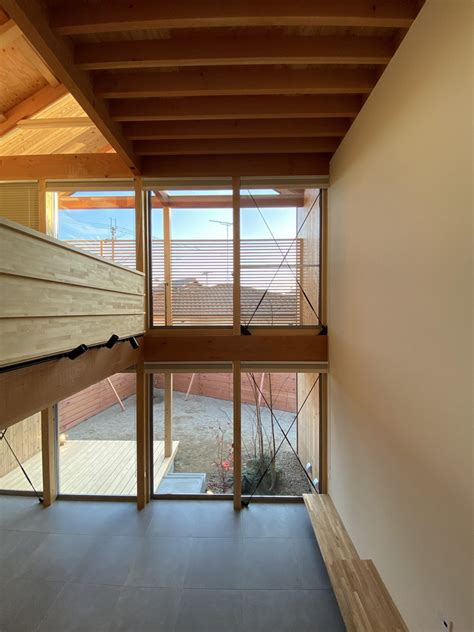 Angled Wooden Louvers Secure Privacy In Atelier Thus House In Higashi