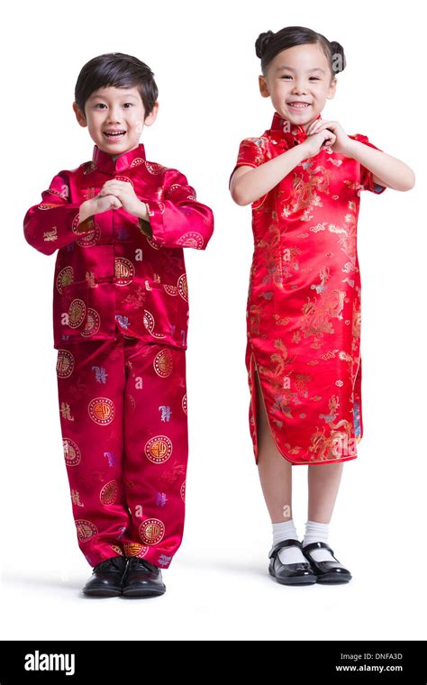 Cute children in traditional clothing celebrating Chinese New Year ...
