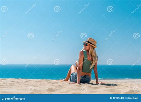 Young Beautiful Blonde Woman Having Sunbath On The Golden Beach Stock