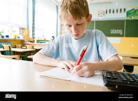 Boy Studying In School Stock Photo Alamy