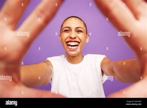 Portrait Of A Cheerful Female With Hands In Front Woman With Shaved