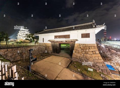 A Yaguramon Gate With Turret Over Illuminated Sujigane Gomon