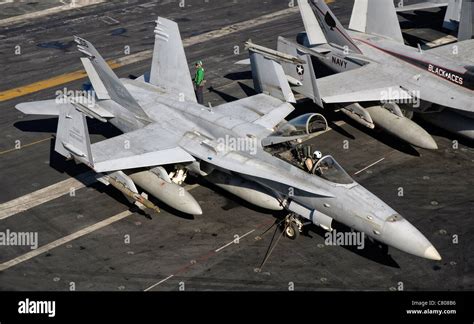 A Us Navy F A C Hornet Parked On The Flight Deck Of Aircraft Carrier