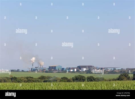 Simunye sugar mill viewed accross irrigated sugar cane fields in the foreground in eSwatini ...