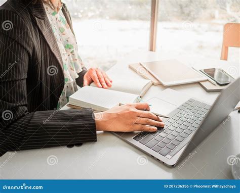 Woman Sitting At Desk And Working At Computer Hands Close Up