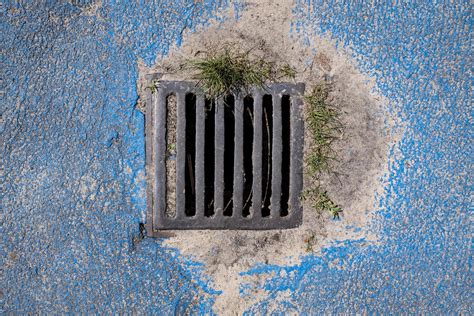 Metal Grating For Storm Sewers To Drain Water From The Road Top View