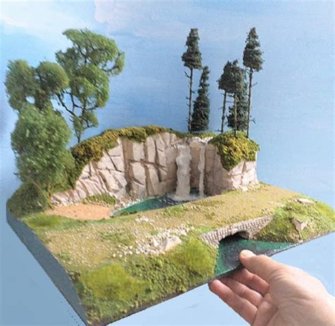 Model diorama with waterfall, lake, forest and country road, scale 1/32 ...