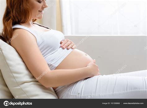 Pregnant Woman Touching Her Belly Stock Photo By AlexLipa 161358866