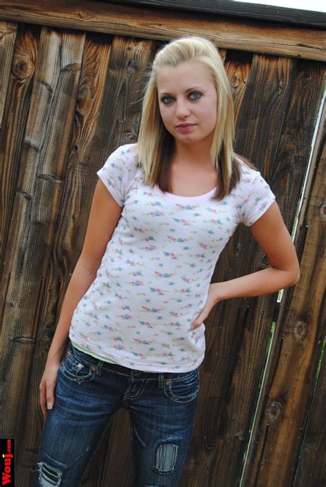 Pretty Blonde Chick Posing In Jeans And Shirt Outdoors 15 Photos