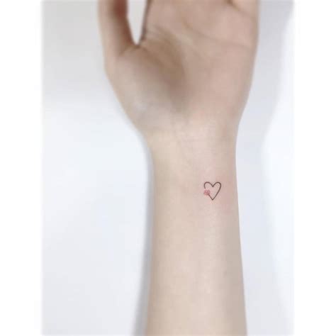 Minimalistic Flower Heart Tattoo Located On The Wrist