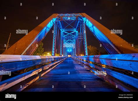Bright Neon Blue Lights On Wooden Walking Bridge Inside Truss Railroad