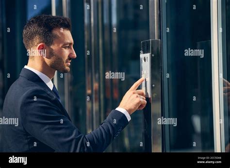 Serious Brunette Man Trying To Enter Building Stock Photo Alamy