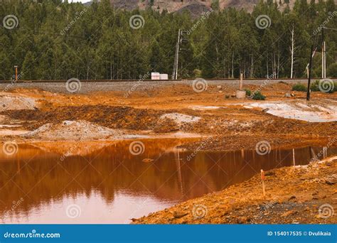 Landscape With Red Soil Polluted Copper Mining Factory In Karabash