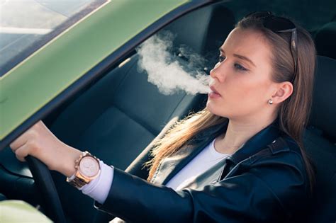 Woman Smoking In A Car Stock Photo Download Image Now Istock