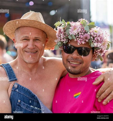 A Beautiful Gay Couple Smiling At Camera With Flowers In Their Hair Stock Photo Alamy