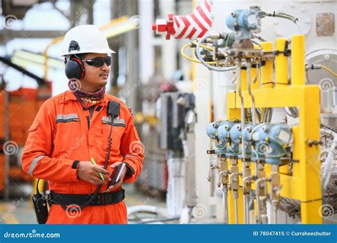 Operator Recording Operation Of Oil And Gas Process At Oil And Rig