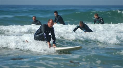 Premium Photo Surfers Ride The Waves In The Ocean