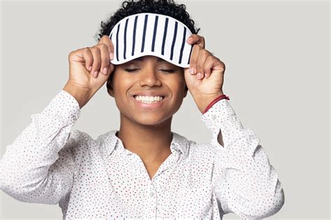 Smiling Biracial Girl Wearing Sleeping Mask On Head Stock Photo