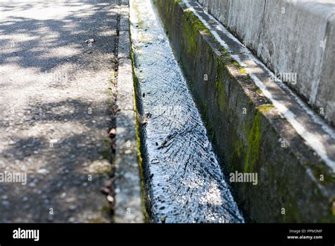 Clean Water Streaming In Concreate Made Small Drainage In Summer Stock