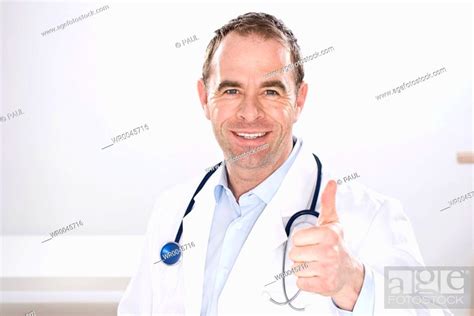 Male Doctor Showing Thumbs Up Sign Stock Photo Picture And Royalty