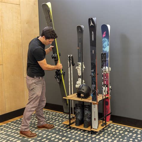 Teal Triangle Freestanding Ski Organizer Holds Pairs Of Skis In