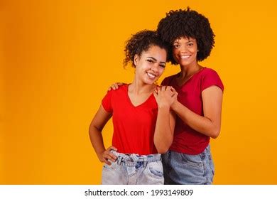 Afro Lesbian Couple On Yellow Background Stock Photo 1989835559 Shutterstock