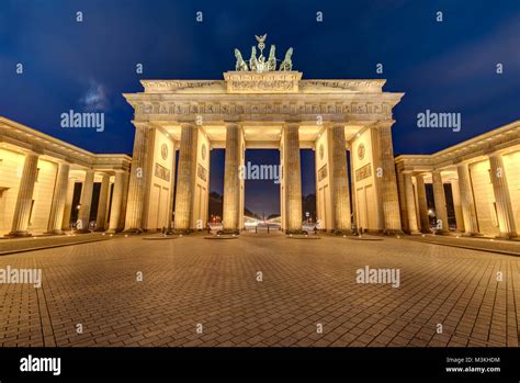 The Illuminated Brandenburg Gate In Berlin At Night Stock Photo Alamy