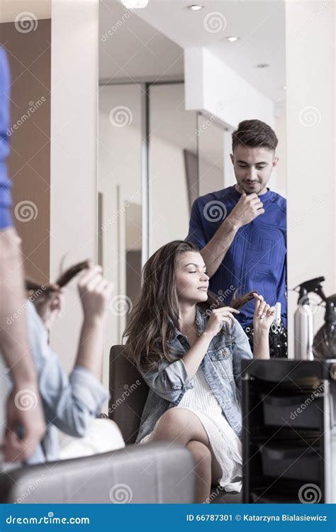Woman Playing with Her Hair Stock Image - Image of hair, beauty: 66787301