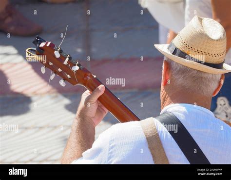 Old man playing music instruments hi-res stock photography and images ...