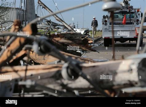 A Tupelo Water And Light Crewman Makes His Way Through The Damage