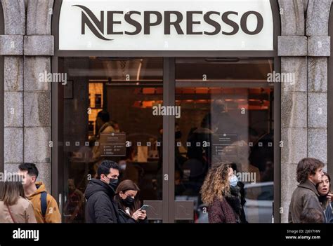 People Queue In Line In Front Of The Swiss High End And World Leader In Coffee Capsules Brand