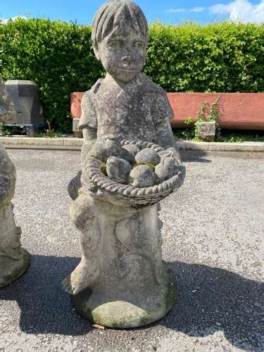 Stone Staues Of 3 Playful Children